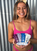 Swimmer holding TRIHARD single-use sachets